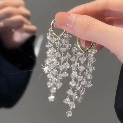 Unique women's sparkling irregular crystal tassel earrings; fashionable party jewelry for women.