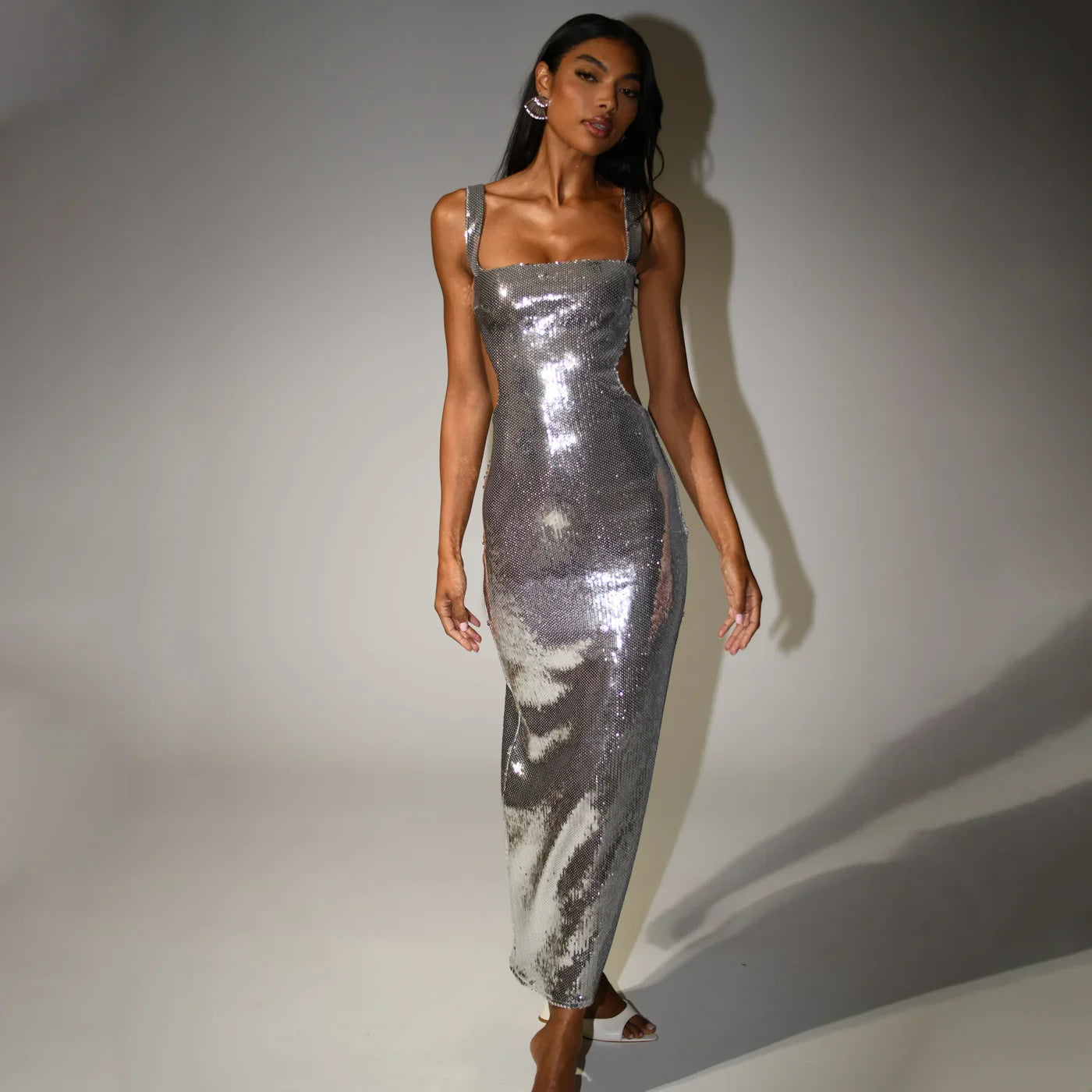Elegant silver sparkling maxi dress for women, ideal as a formal gown or glamorous party dress.