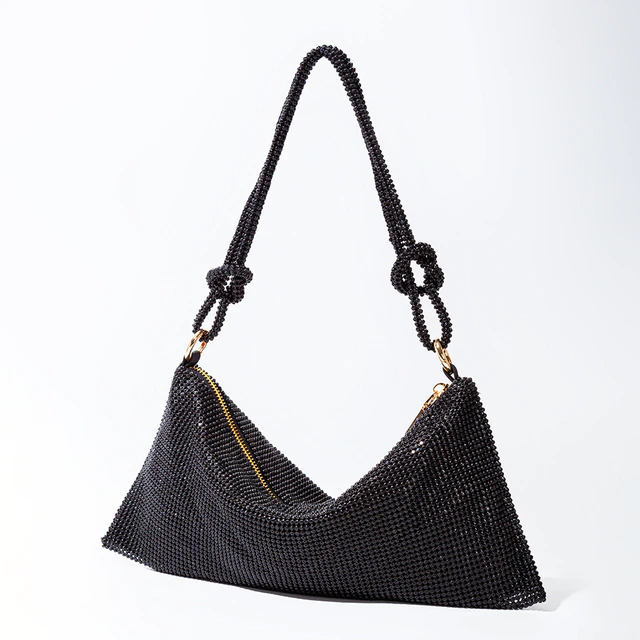 Women's sparkling rhinestone clutch, an opulent evening bag and glamorous party accessory.