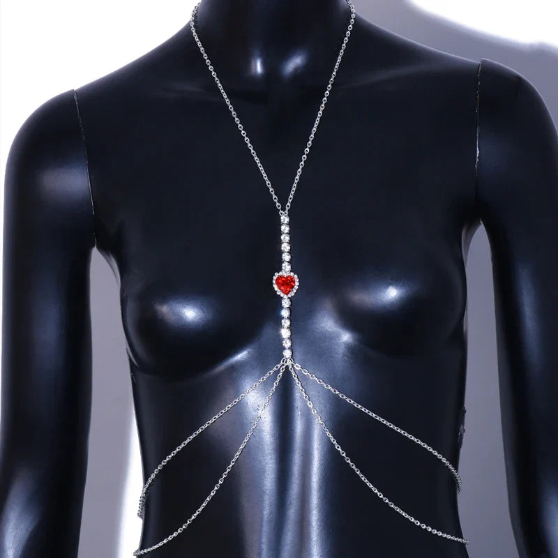Red stone rhinestone heart chest chain, women's vibrant body jewelry, sparkling and bold fashion accessory.