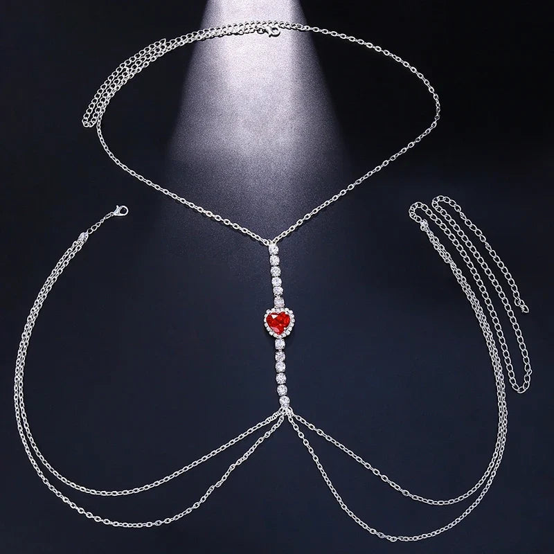 Gold rhinestone heart chest chain, women's statement body jewelry, perfect for dazzling evening wear.