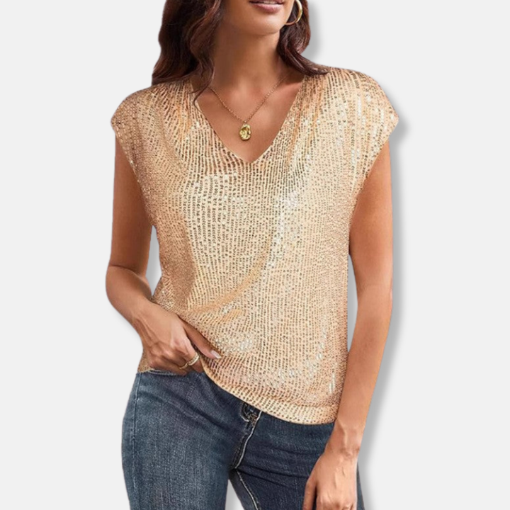 Glamorous women's sparkling V-neck top with a relaxed fit, perfect for festive parties. Shimmering short sleeve evening blouse.