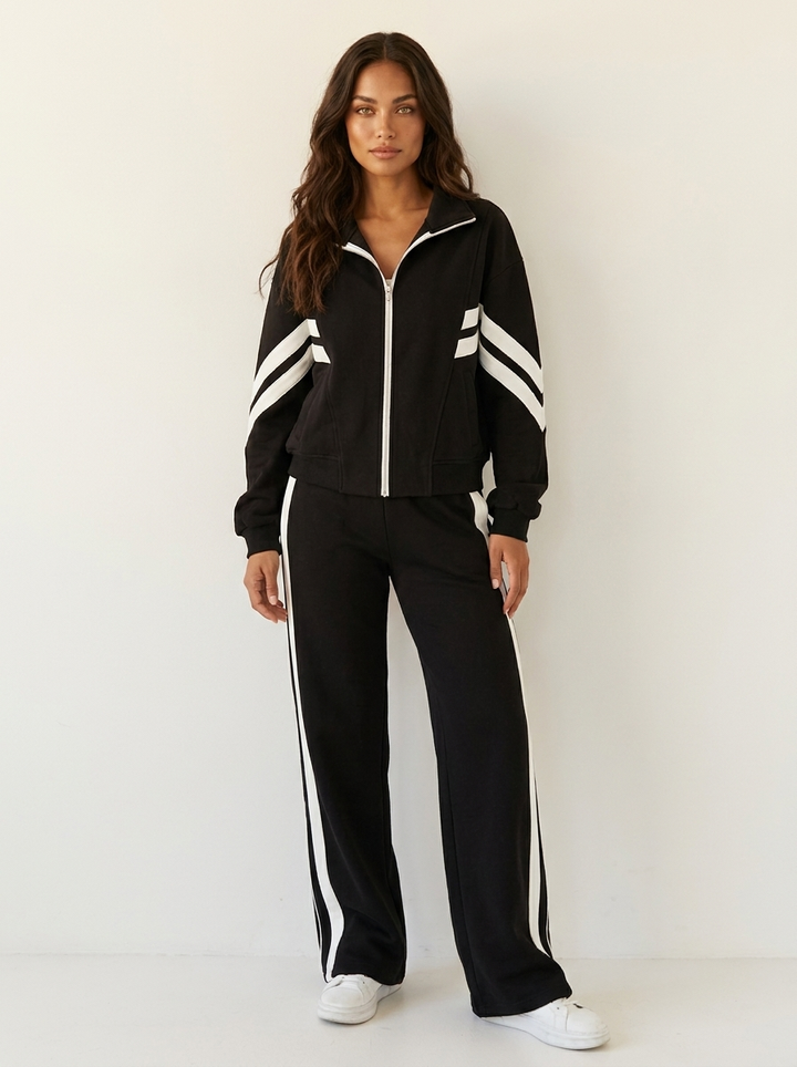 Comfortable women's wide leg track pants with matching zip-up jacket, a stylish lounge wear set.