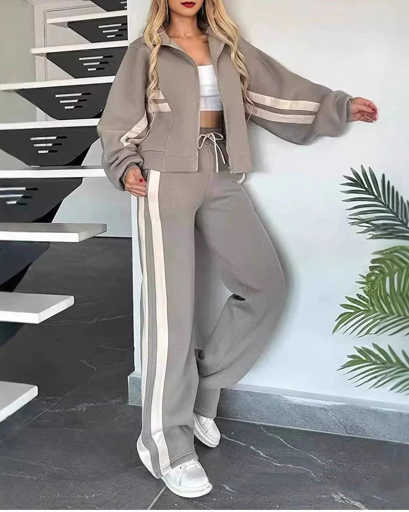 Women's two-piece sporty tracksuit set, contrast stripe zip-up top & wide leg pants for casual comfort.