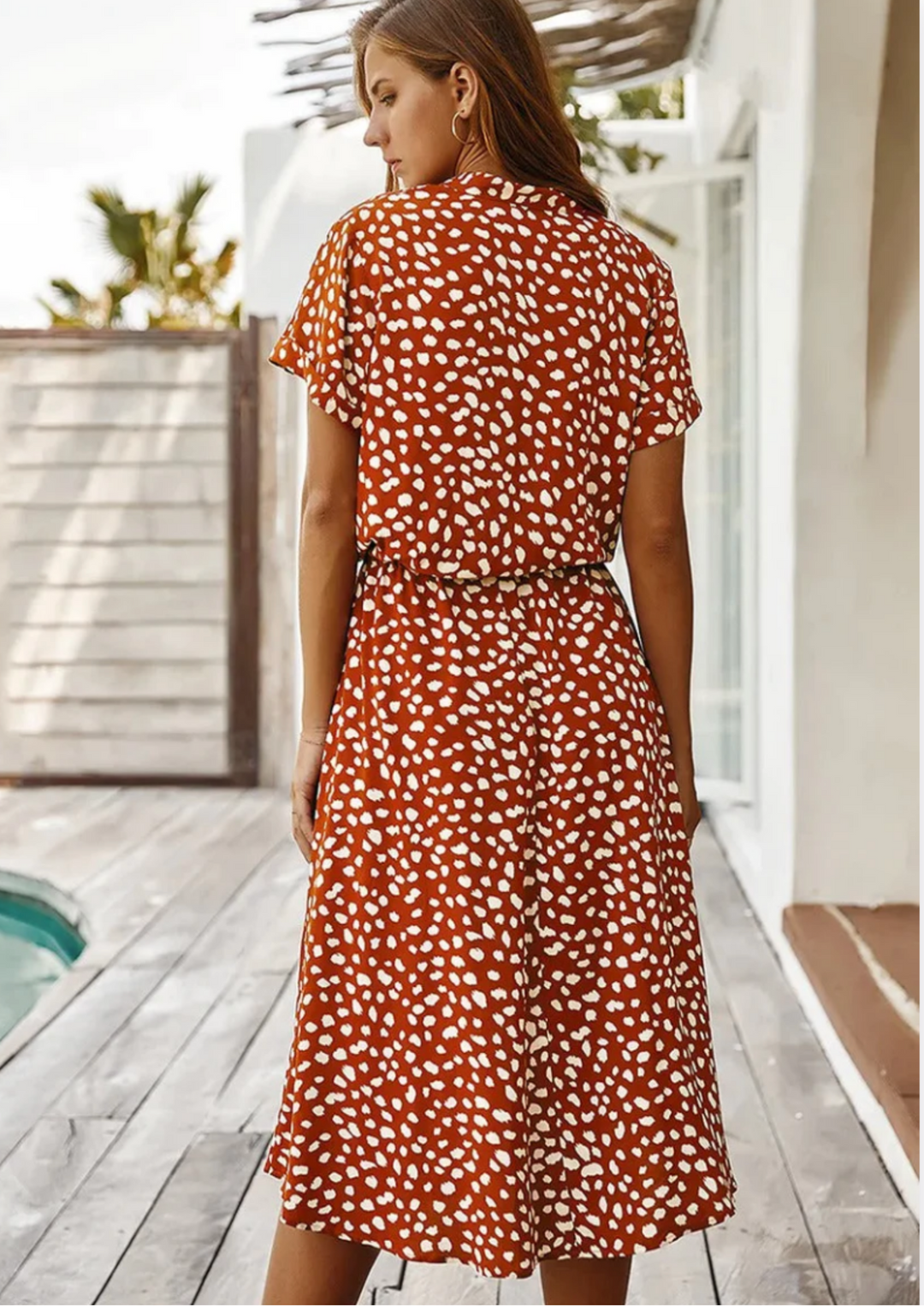 Chic women's day dress: spotted print midi, button-front, flowy silhouette for summer style.