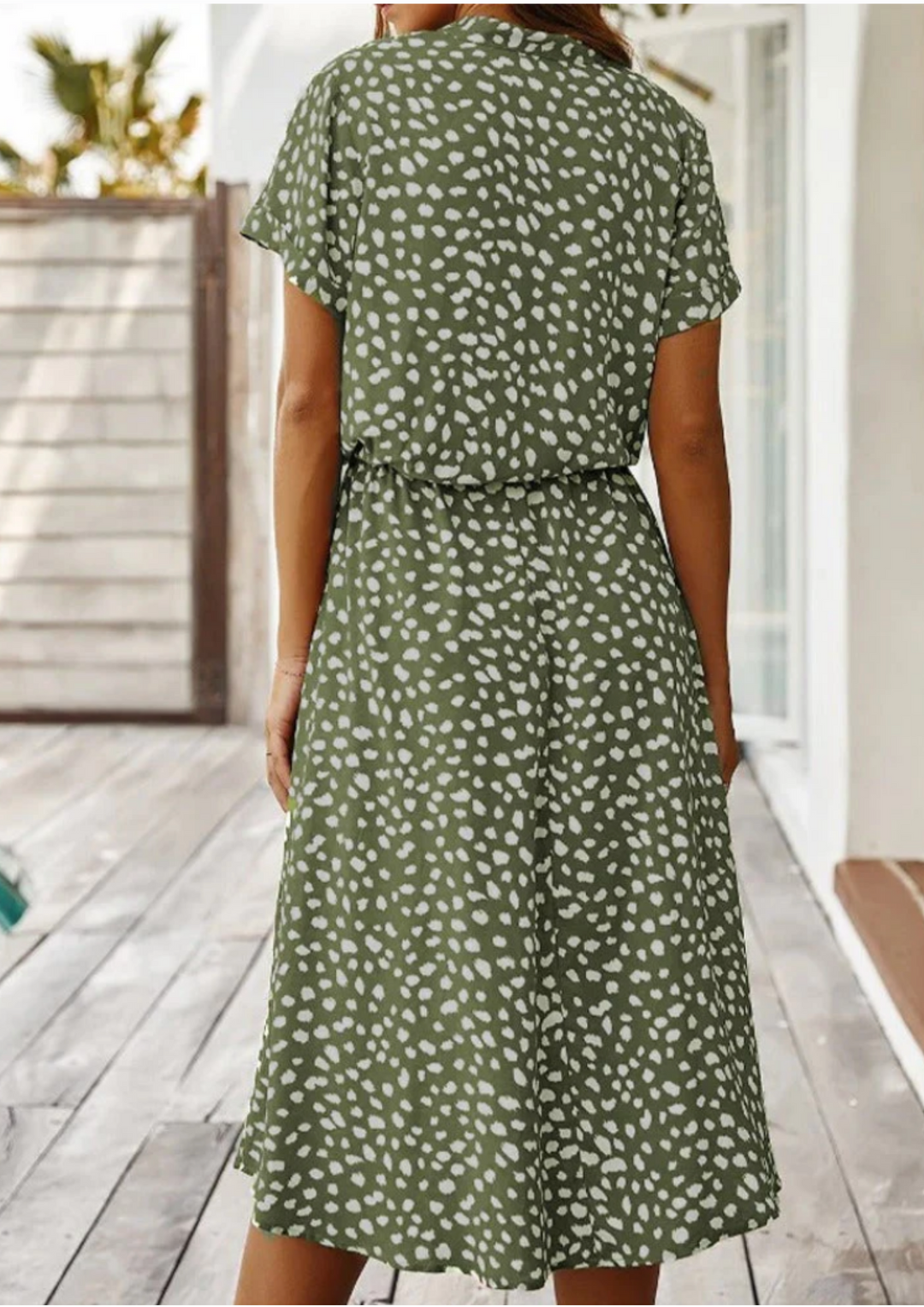 Trendy women's spotted print midi dress with button-down front, flutter sleeves, ideal for spring.