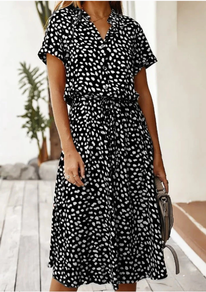 Casual women's day dress: spotted print midi with button accents, V-neck, & adjustable waist.