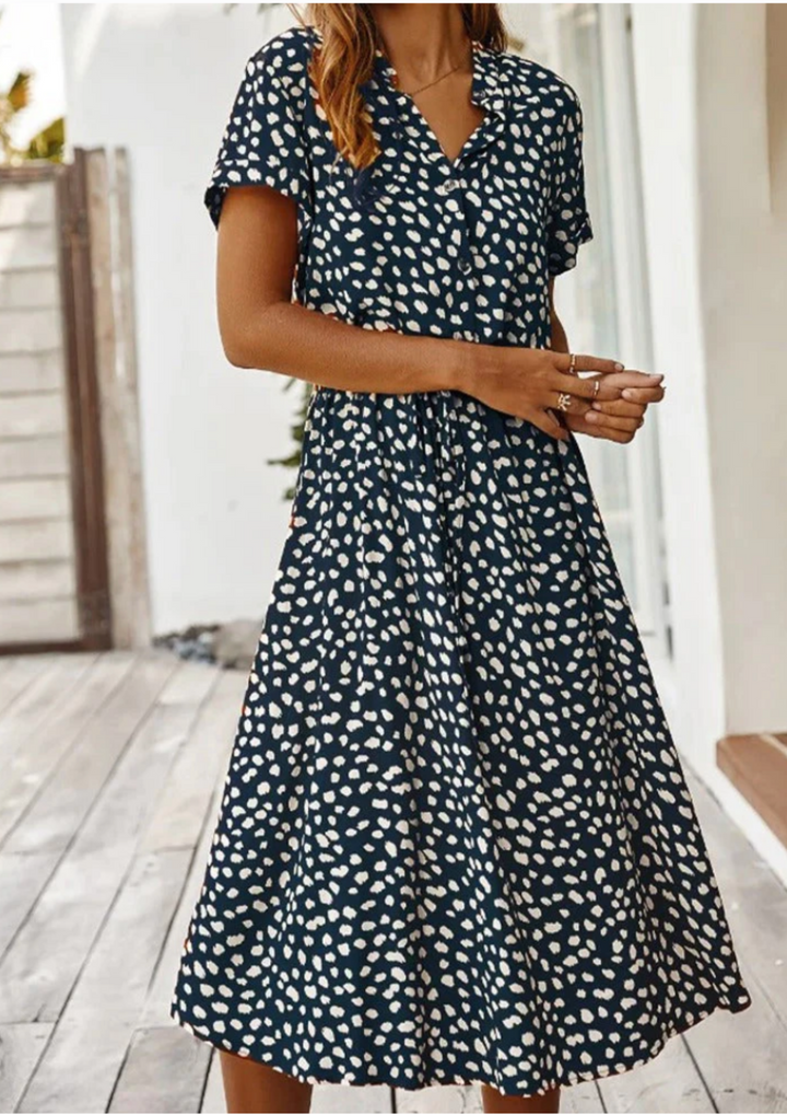 Spring/summer women's midi dress: chic spotted print, full button placket & comfortable flowy fit.