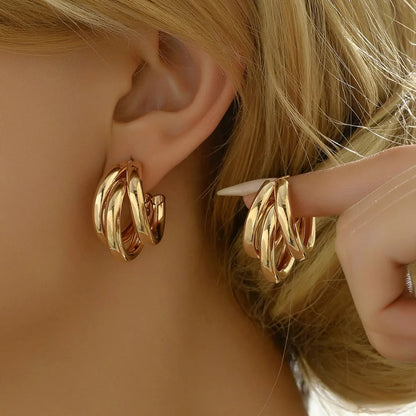 Women's stacked hoop earrings, elegant gold & silver layered design. Perfect hypoallergenic jewelry.