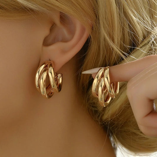 Women's stacked hoop earrings, elegant gold & silver layered design. Perfect hypoallergenic jewelry.
