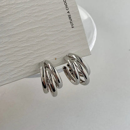 Delicate women's stacked hoop earrings, elegant design in gold and silver, perfect for everyday wear.