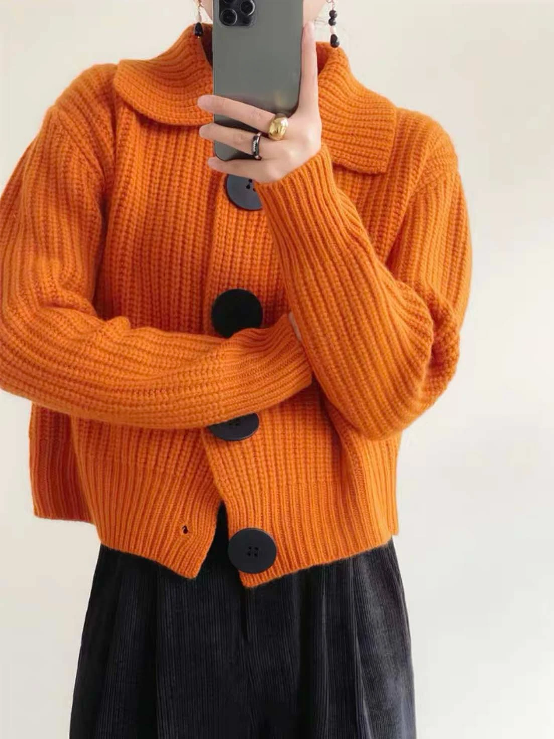Effortless style women's statement sweater, oversized fit, button-down front, versatile for autumn.