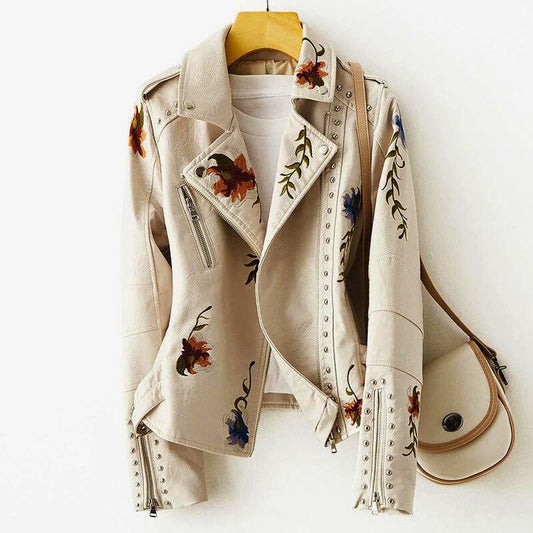 Women's statement jacket with elaborate floral embroidery, edgy studs, and unique design. Perfect fashion-forward outerwear.