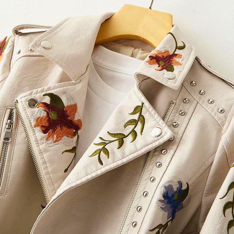 Distinctive women's statement jacket featuring beautiful floral embroidery & edgy stud embellishments for unique outerwear.