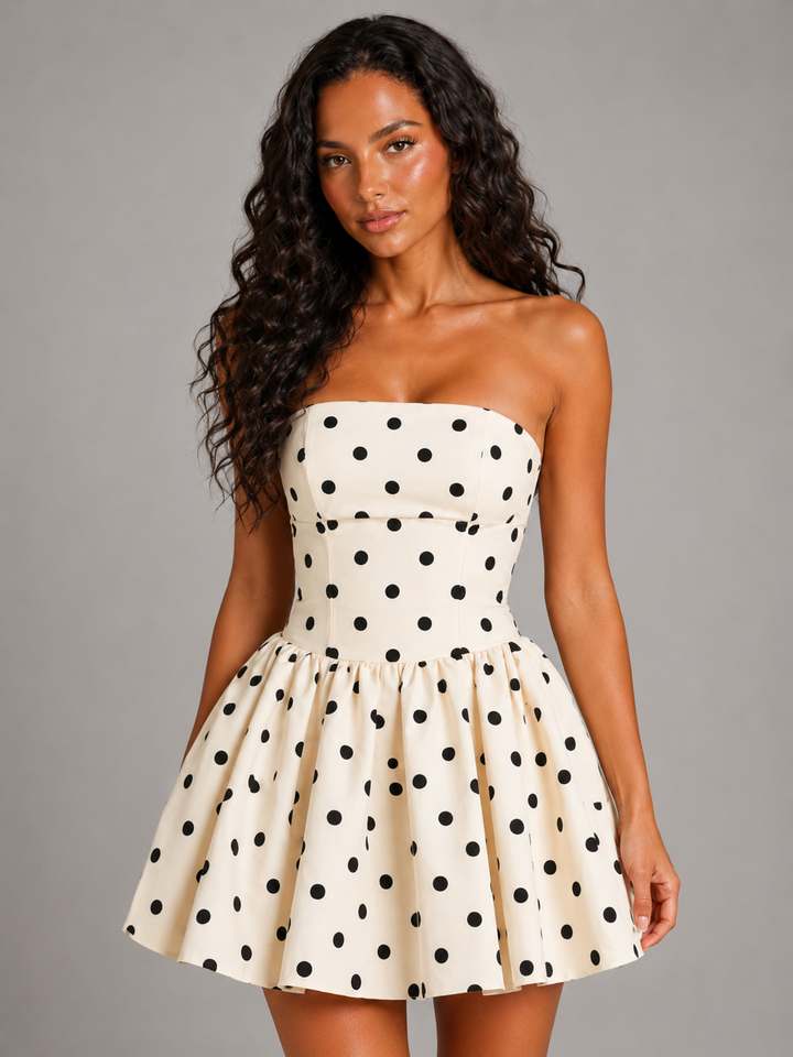 Flattering strapless women's polka dot mini dress, corset top & skater skirt. Perfect party attire.