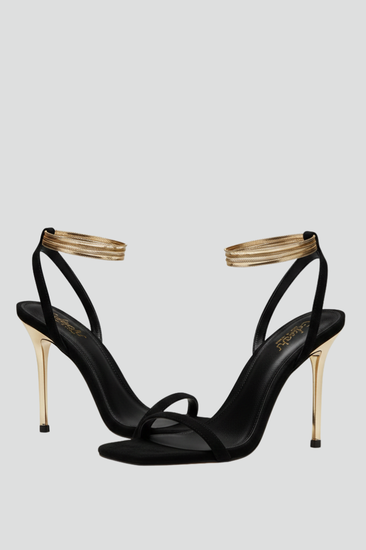 Women's strappy heeled sandals with elegant ankle wrap, perfect for evening wear.
