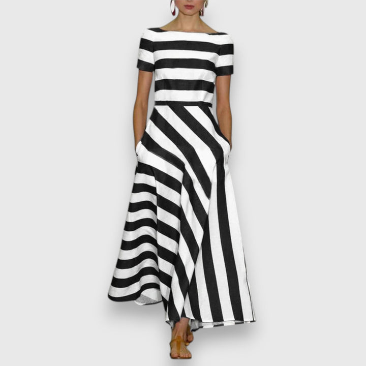Nautical women's short-sleeve striped maxi dress with a sophisticated bateau neckline & convenient side pockets.