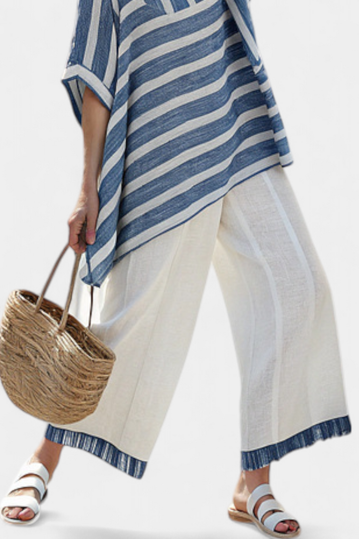 Comfortable women's striped loungewear set with batwing top & wide leg pants, great for travel.