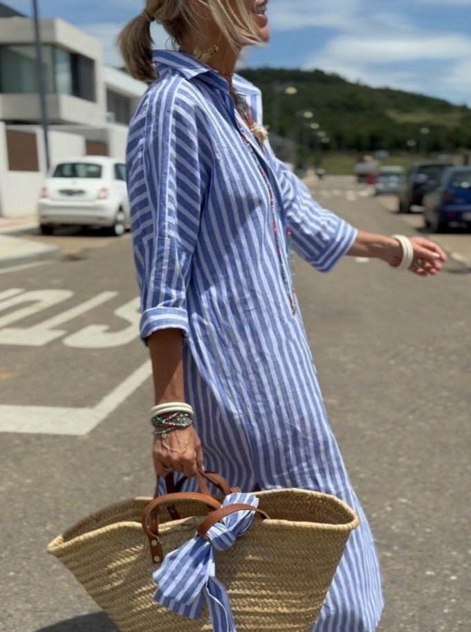 Pink striped button-front midi dress for women, relaxed fit, ideal casual summer or vacation wear.