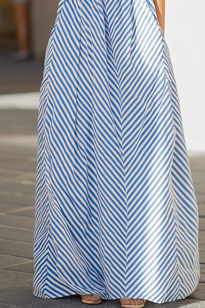 Fashionable women's striped maxi dress with a chic halter neck, perfect as a relaxed summer beach or casual sundress.