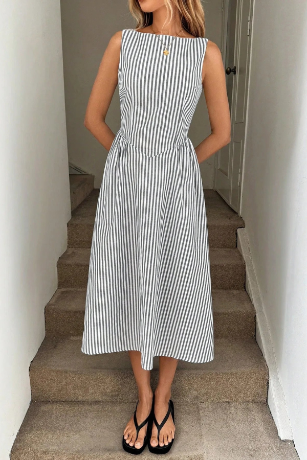 Stylish women's pleated striped midi dress with a flattering halter neck. Perfect summer casual wear.