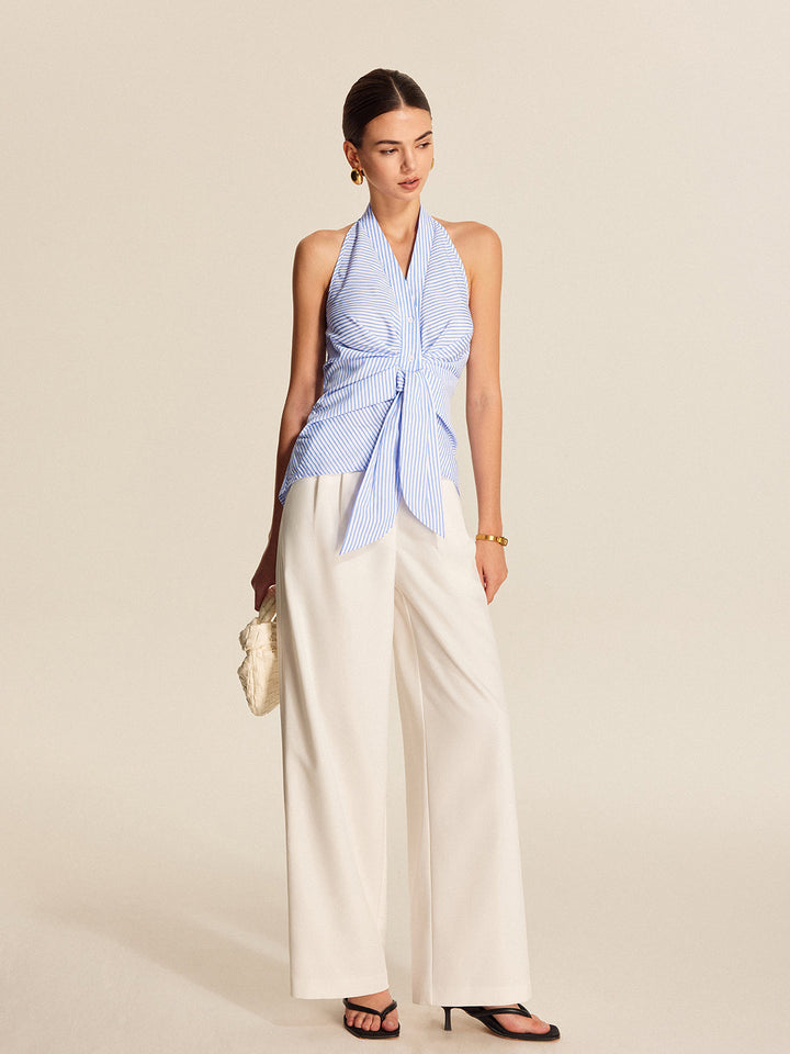 Professional women's sleeveless striped halter blouse, elegant tie front top for work or office.