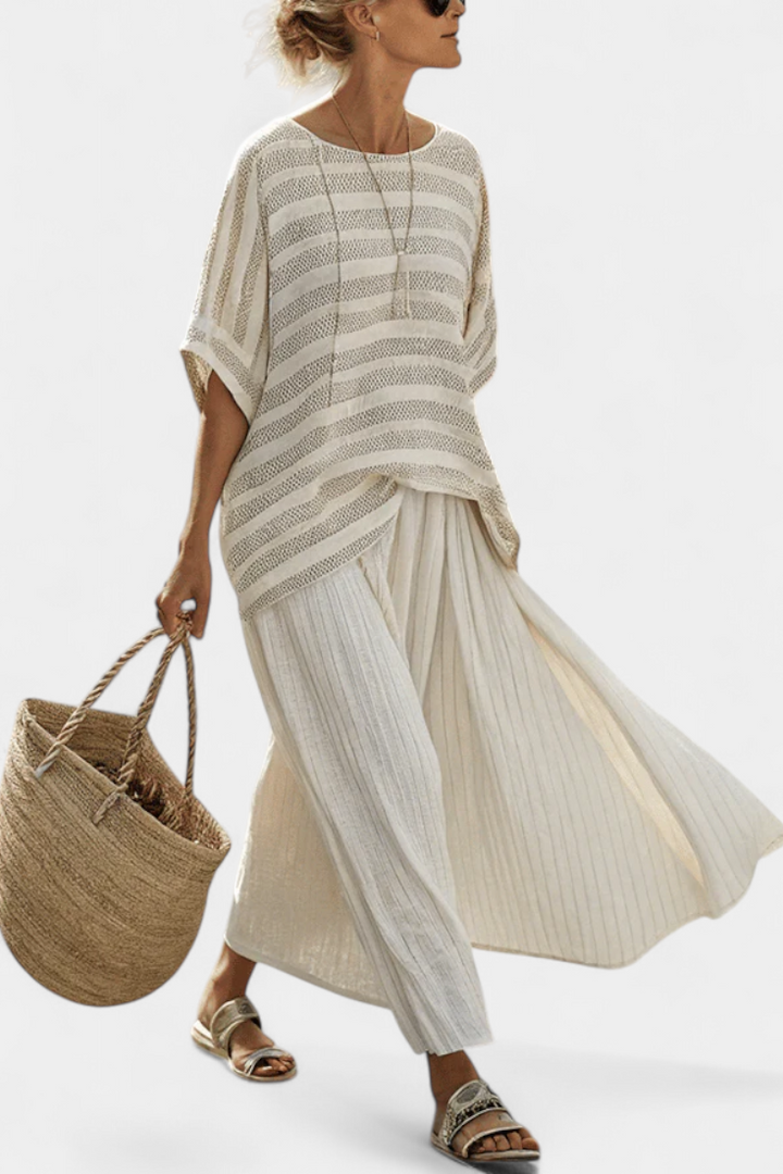 Women's striped knit top and flowy maxi skirt matching set, perfect for summer vacation or beach style.