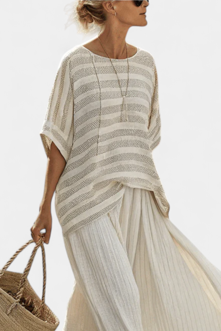 Relaxed fit women's two-piece set featuring a striped knit top & long flowy maxi skirt for spring & summer casual chic.