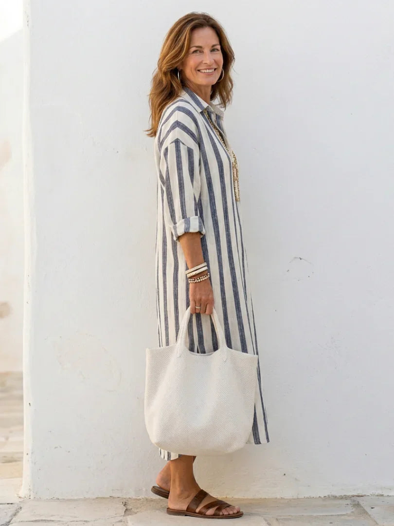 Relaxed fit Women's Striped Midi Shirt Dress with button front, ideal for versatile styling.