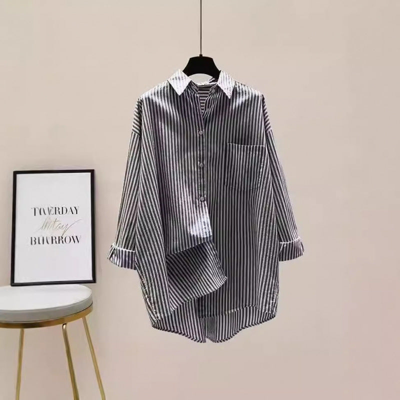 Effortless style: Oversized striped button-down shirt for women, featuring a comfortable longline fit. Casual & versatile.