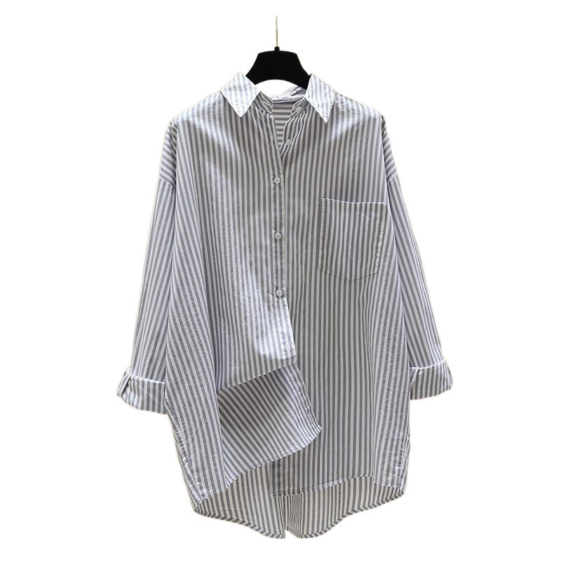 Versatile women's longline striped oversized button-down shirt, great for layering in spring, summer, or fall outfits.