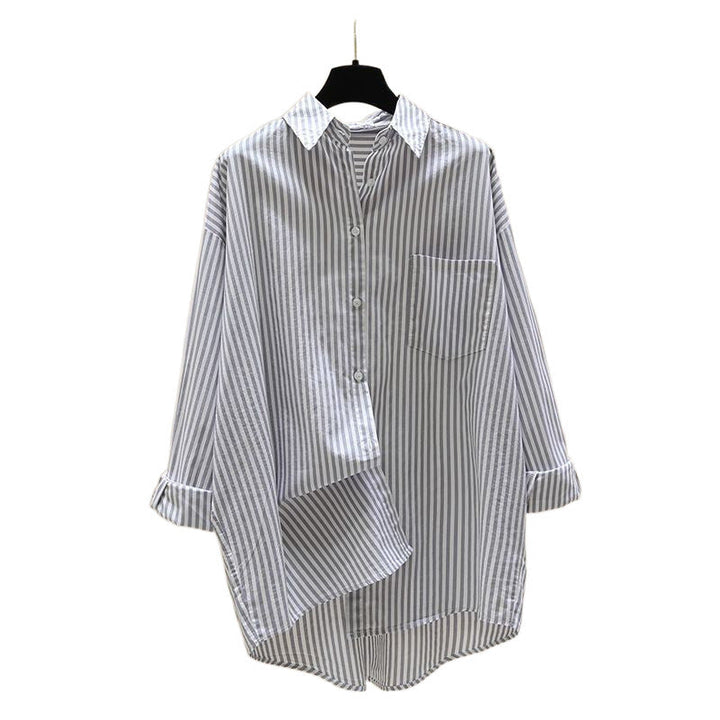 Versatile women's longline striped oversized button-down shirt, great for layering in spring, summer, or fall outfits.