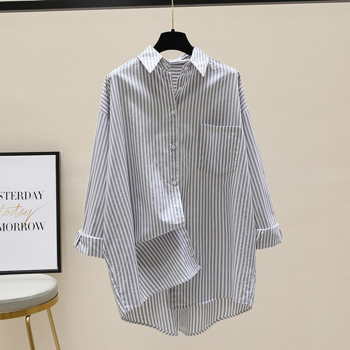 Comfortable women's oversized striped button-down shirt. A longline, dropped shoulder top for versatile casual style.
