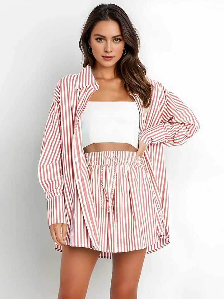 Fashionable women's striped two-piece summer set. A casual, oversized cotton poplin outfit for resort wear.