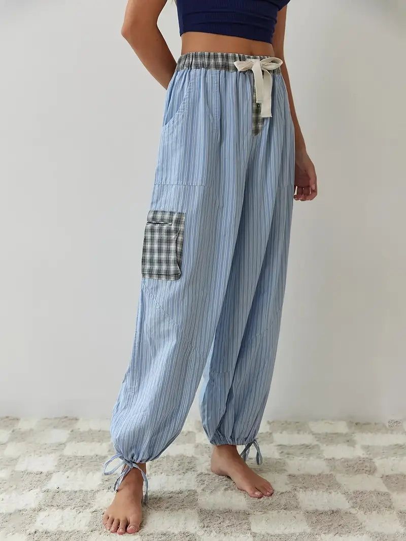 Cozy women's sleepwear: a striped & plaid patchwork lounge set. Perfect pajamas for comfort.