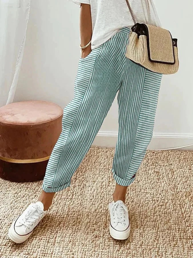 Stylish women's striped relaxed fit trousers with a comfortable, flowy design. Perfect for everyday fashion.