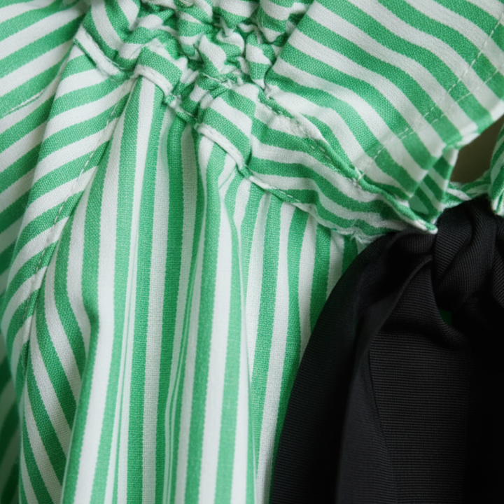 Fashionable striped ruffle blouse for women, with a lovely bow tie & stylish balloon sleeves.