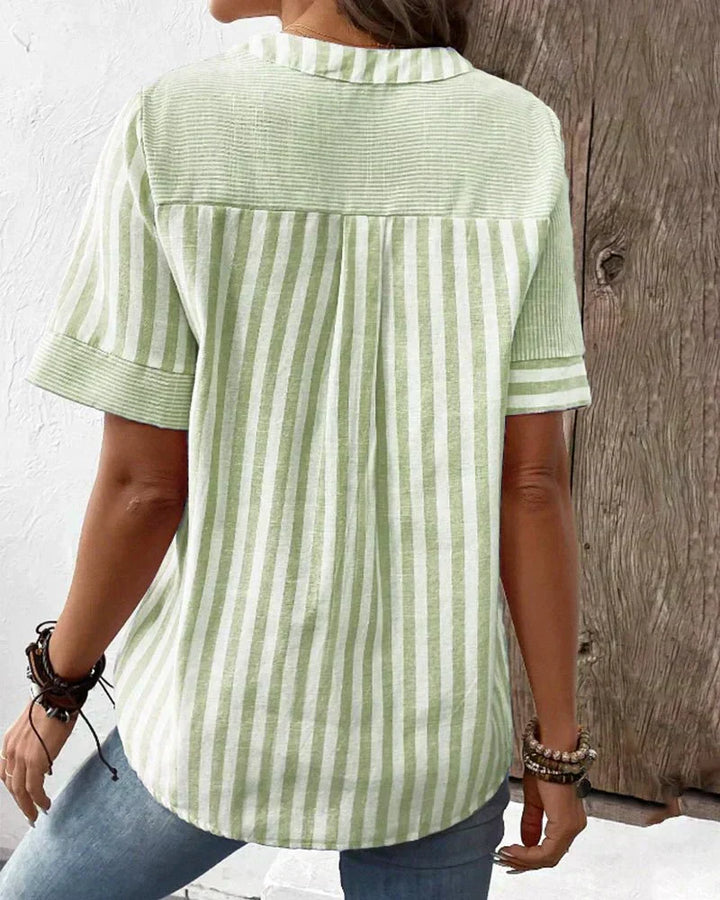 Chic striped short sleeve blouse for women. Easily transitions from work wear to casual everyday style.