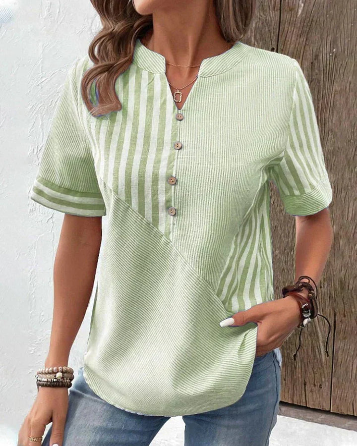 Crisp striped short sleeve women's blouse, perfect for warm weather, casual outings, or a polished office look.
