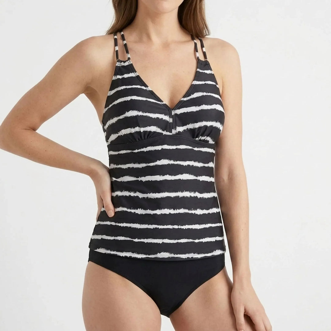 Women's striped tankini set with adjustable straps. Stylish two-piece swimwear, perfect for sunny summer beach vacation.