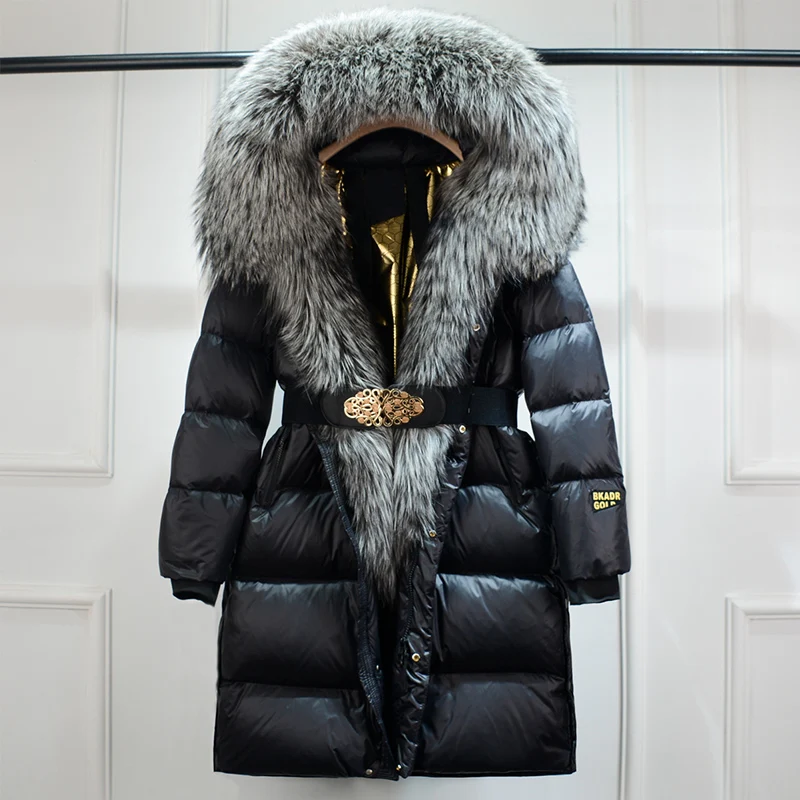 Women's stylish belted puffer coat for winter warmth. Long, fashionable outerwear perfect for cold weather.