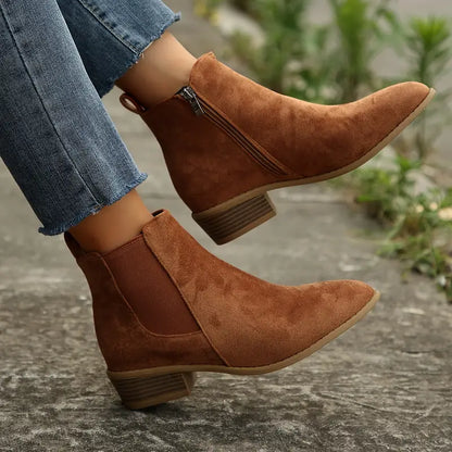 Women's stylish black leather Chelsea boots, perfect for everyday comfort and versatile fall fashion.