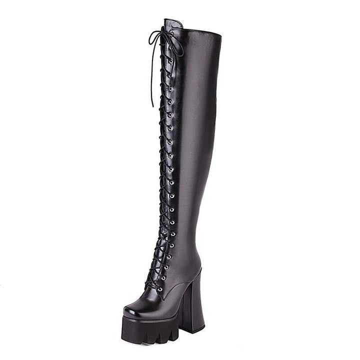 Women's stylish black platform knee boots for an edgy, fashionable look.