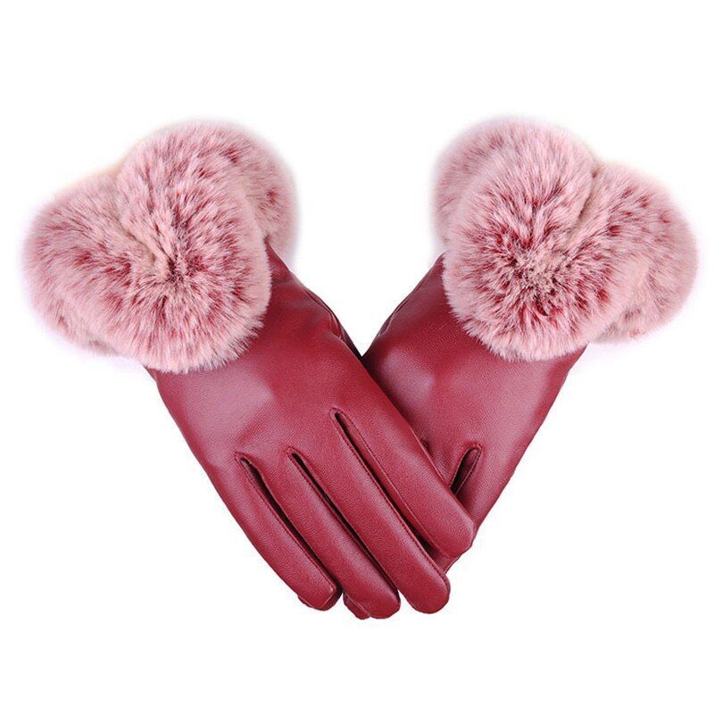 Warm winter women's gloves made from sleek PU leather, adorned with soft faux fur for comfort and style.