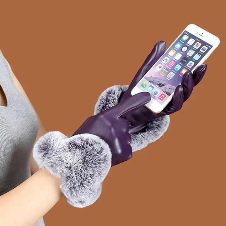 Stylish women's black PU leather winter gloves with a soft faux fur trim, ideal for warmth and fashion.
