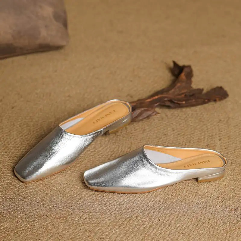 Slip-on women's mules with a distinctive square toe and comfortable block heel.