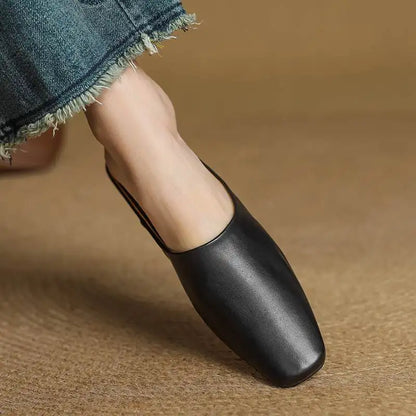 Modern slip-on mules for women with a unique square toe and stable block heel.