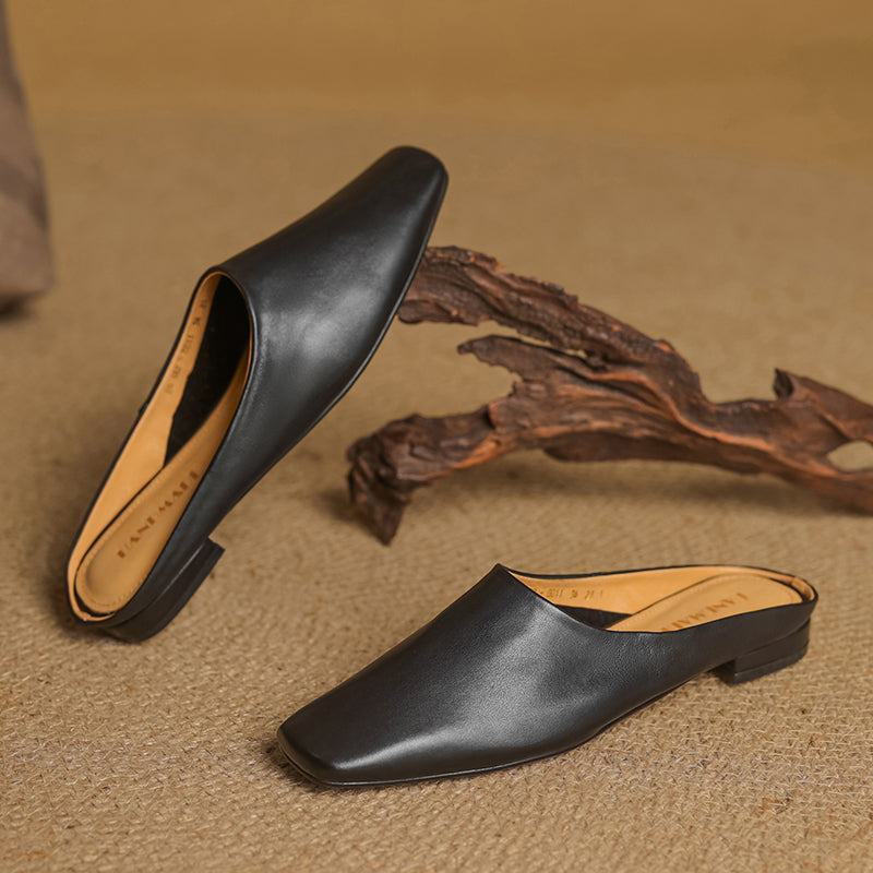 Versatile women's black square-toe mules, offering an elegant look and easy slip-on comfort.
