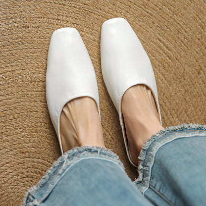 Stylish white square-toe mules with a comfortable block heel, a must-have for modern women.