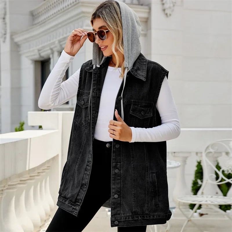 Relaxed fit women's denim vest with hood, ideal for casual layering. Stylish sleeveless outerwear for spring & fall.